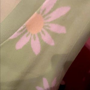 Green button vest with white sunflowers in a size Medium